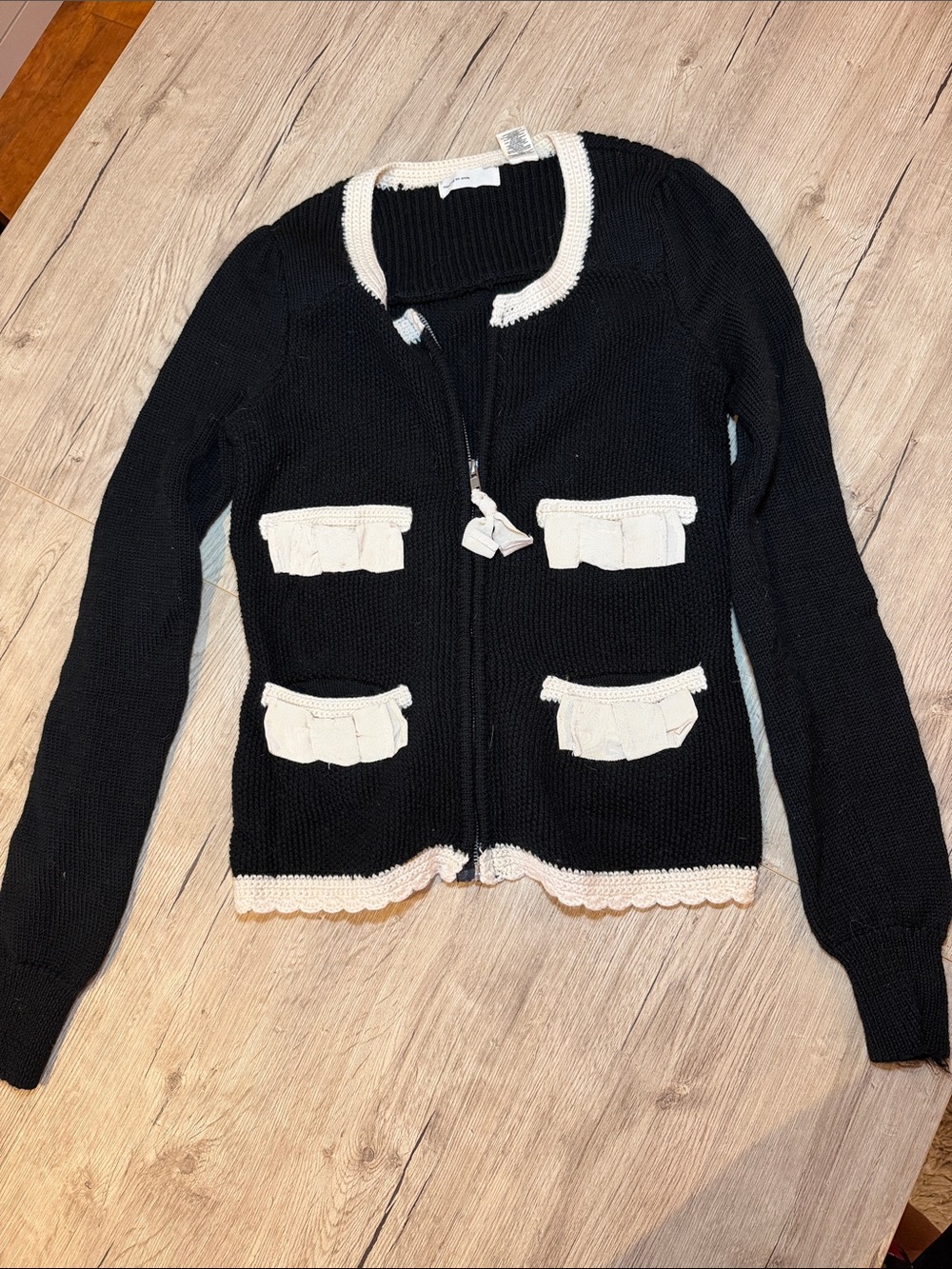 Black Knit Zip Cardigan with Cream Trim and Pocket Ruffles